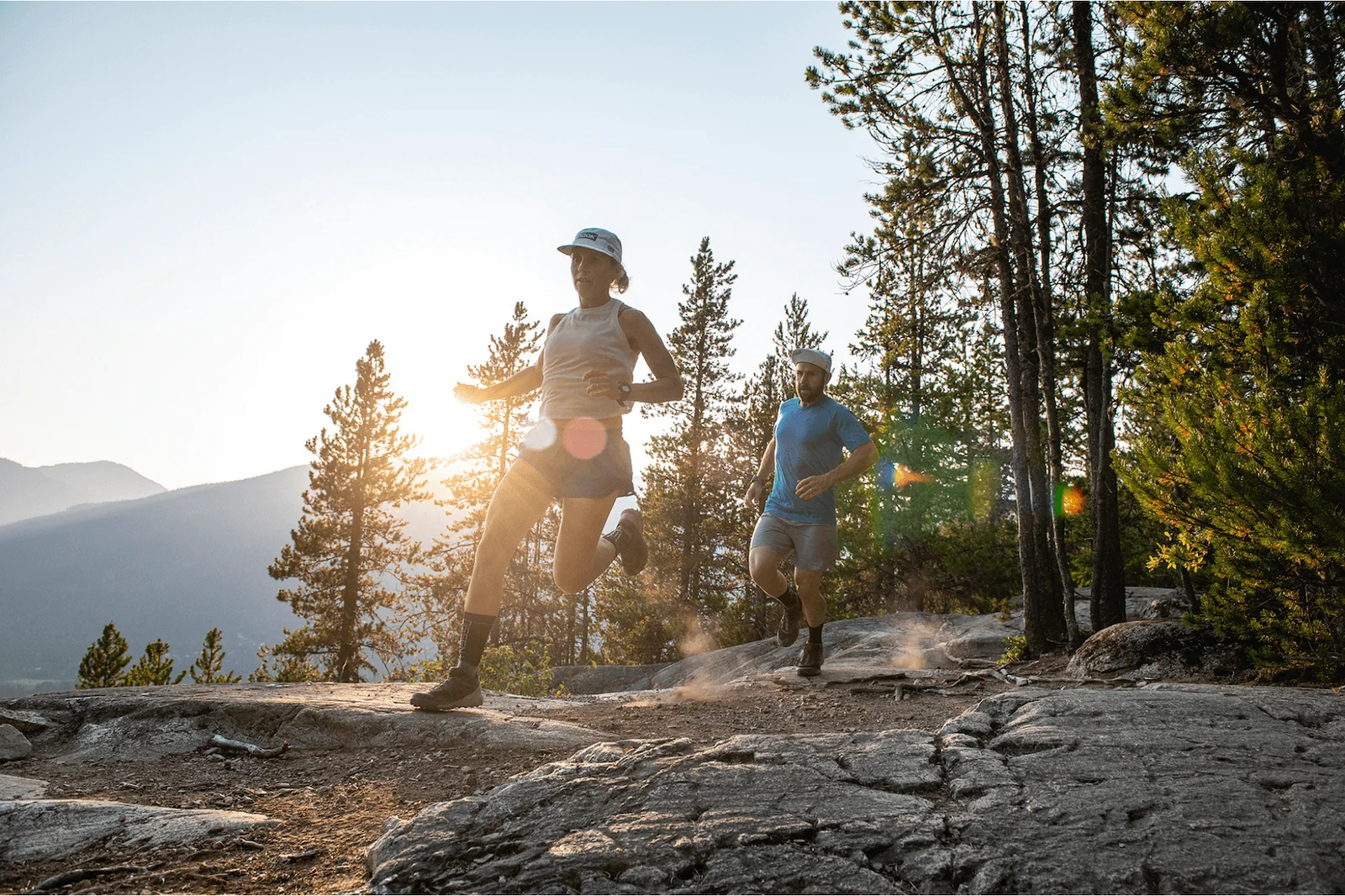 Kristian Manietta and Charlotte Paul running together in the mountains